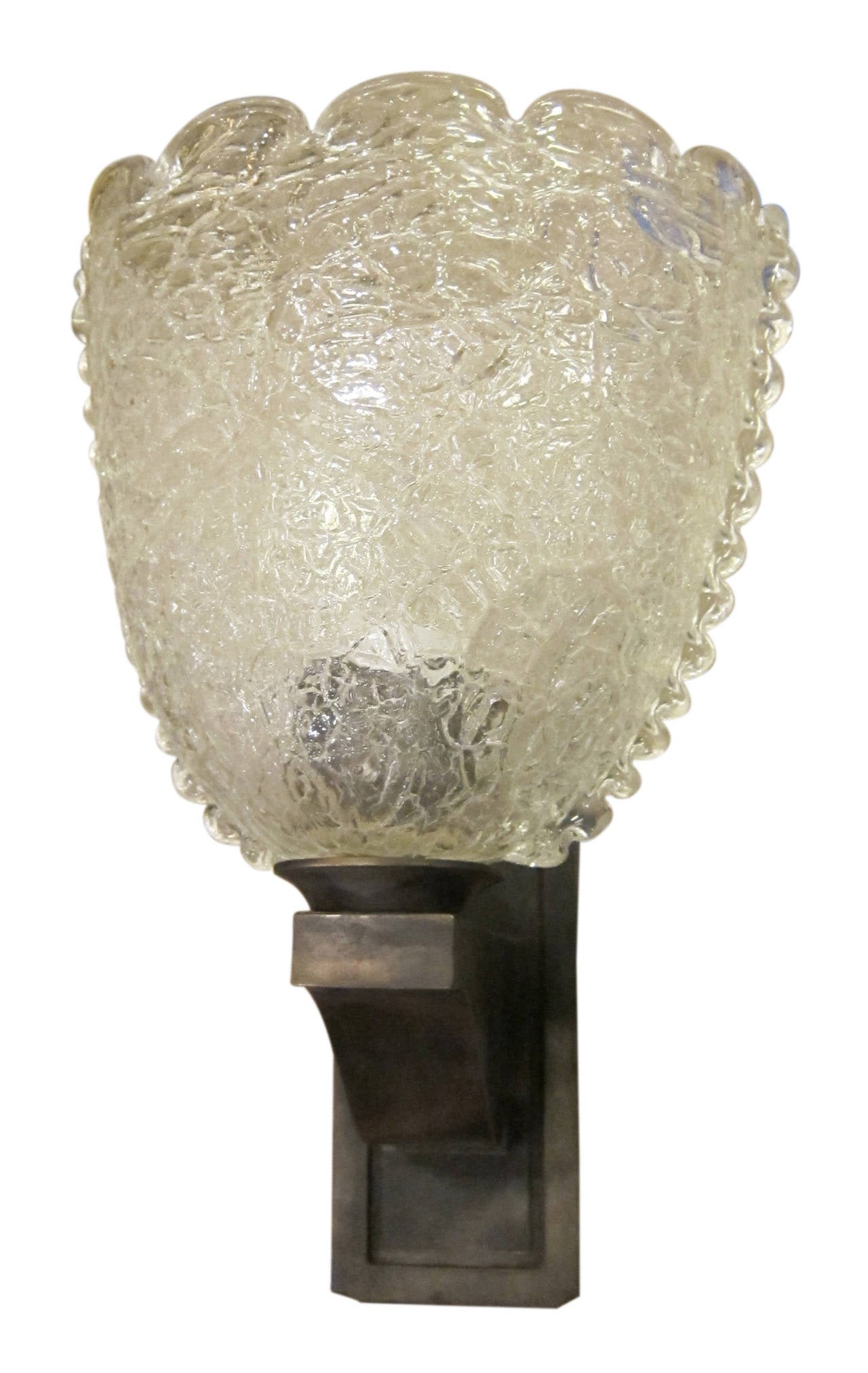 A pair of 1940s Murano glass sconces with waved pattern on top and a nice crackled finish. This item can be viewed at our 149 Madison Avenue location in Manhattan.