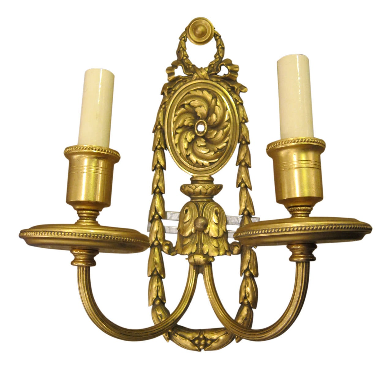 1900s pair of Louis XVI style gilded bronze sconces by E. F. Caldwell. This can be seen at our 2420 Broadway location on the upper west side in Manhattan.