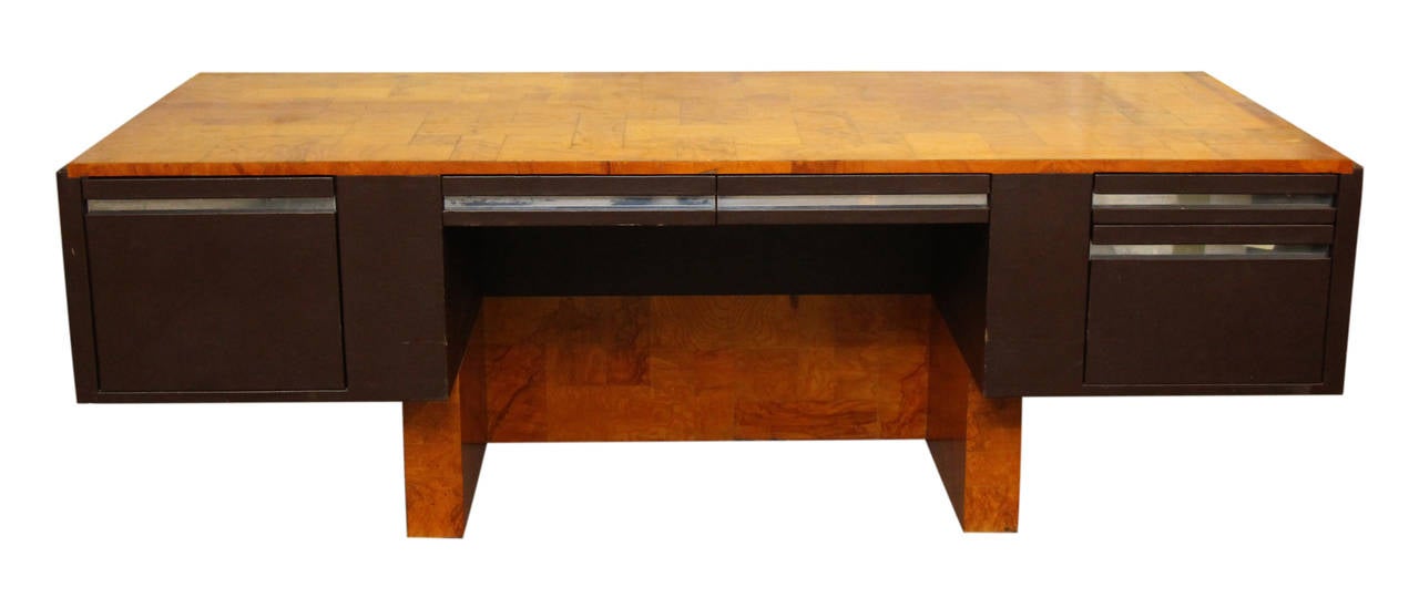 Salvaged out of Miami, this is an attractive desk with burled walnut veneer and a lacquered finish. Designed by American furniture designer and sculptor Paul Evans. The inset interior cabinet has two shelves. Originally designer for Directional