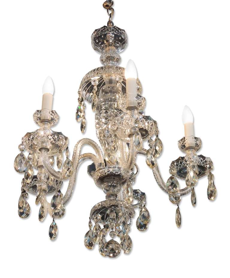 Delicate five-arm cut crystal chandelier made by Waterford, circa late 1800s. Waterford Crystal first started operations in 1783 in Waterford, Ireland. This can be viewed at one of our New York City locations. Please inquire for the exact address.