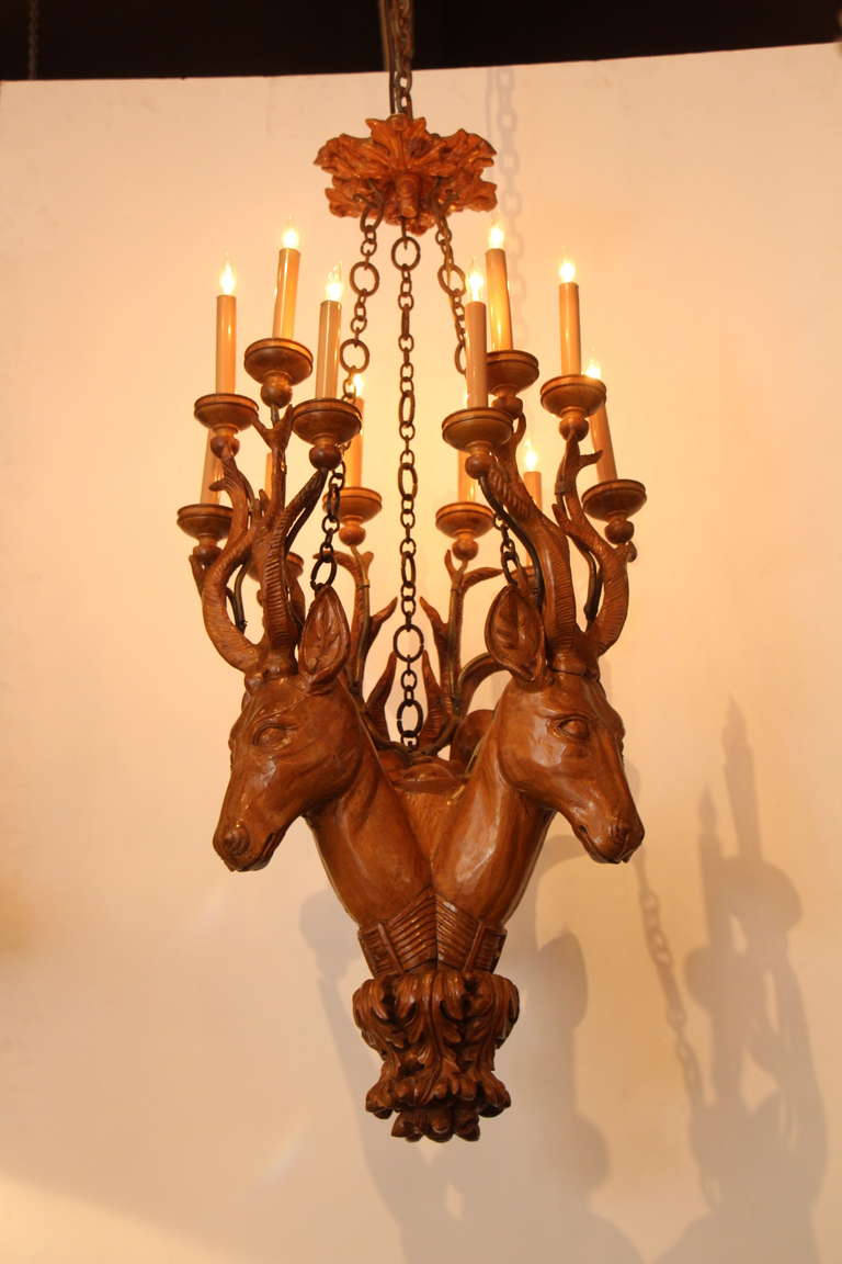 This is a six armed hand carved deer chandelier that was salvaged from Texas. This can be seen at our Madison Avenue location.