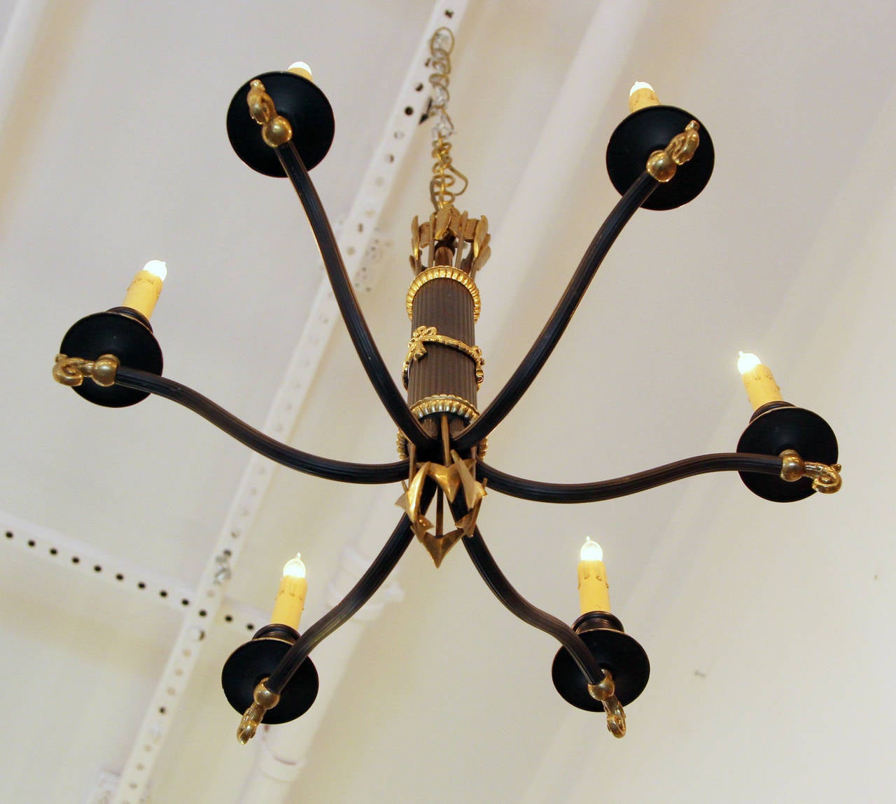 Mid-20th Century 1930s French Regency Gold and Black Six-Light Chandelier with Swags and Spears