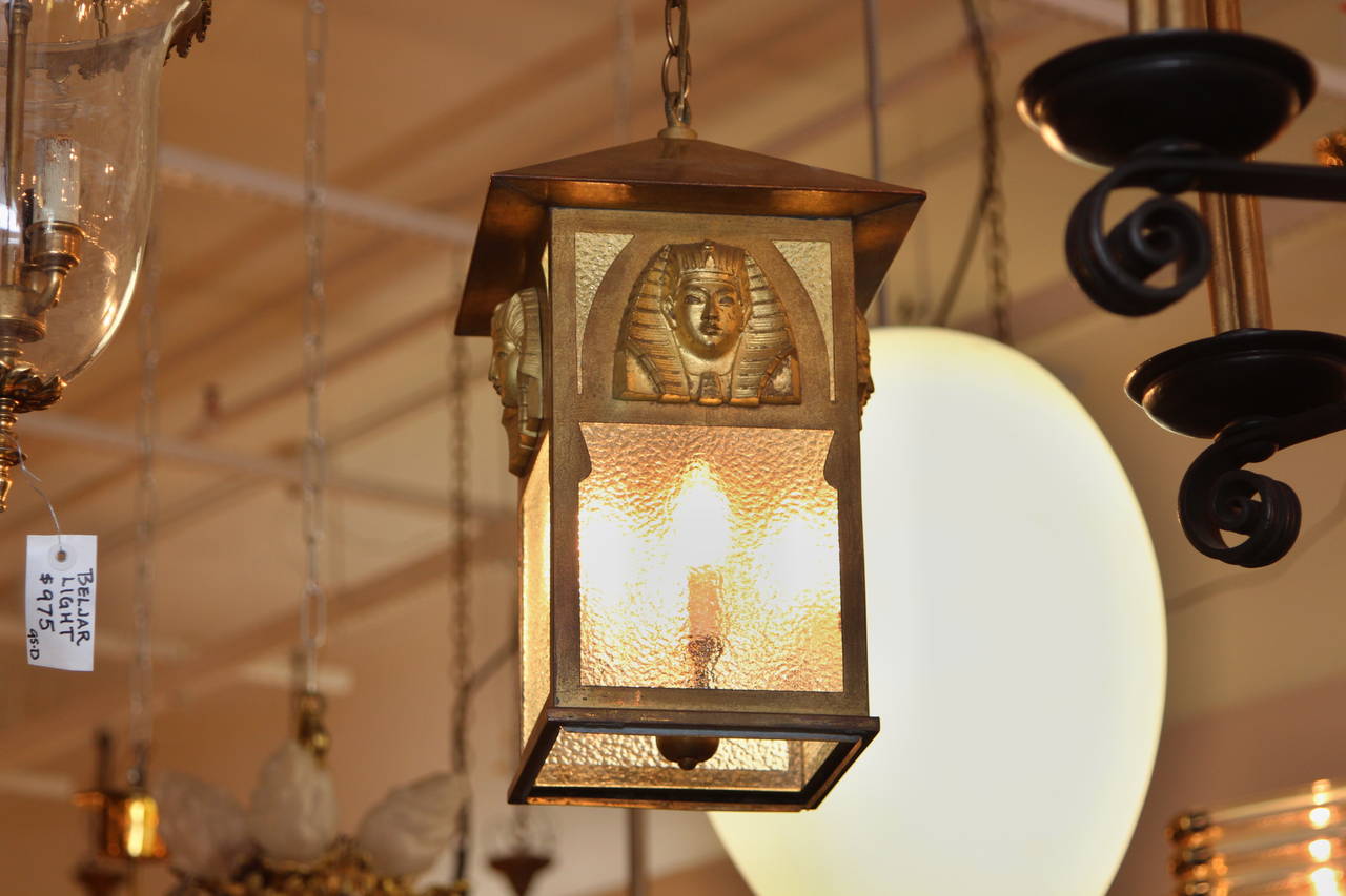 Egyptian Pharaoh Revival style lantern from the 1900s. It is painted a gold finish with textured glass and four lights. Cleaned and refurbished. This can be seen at our 302 Bowery location in NoHo in Manhattan.