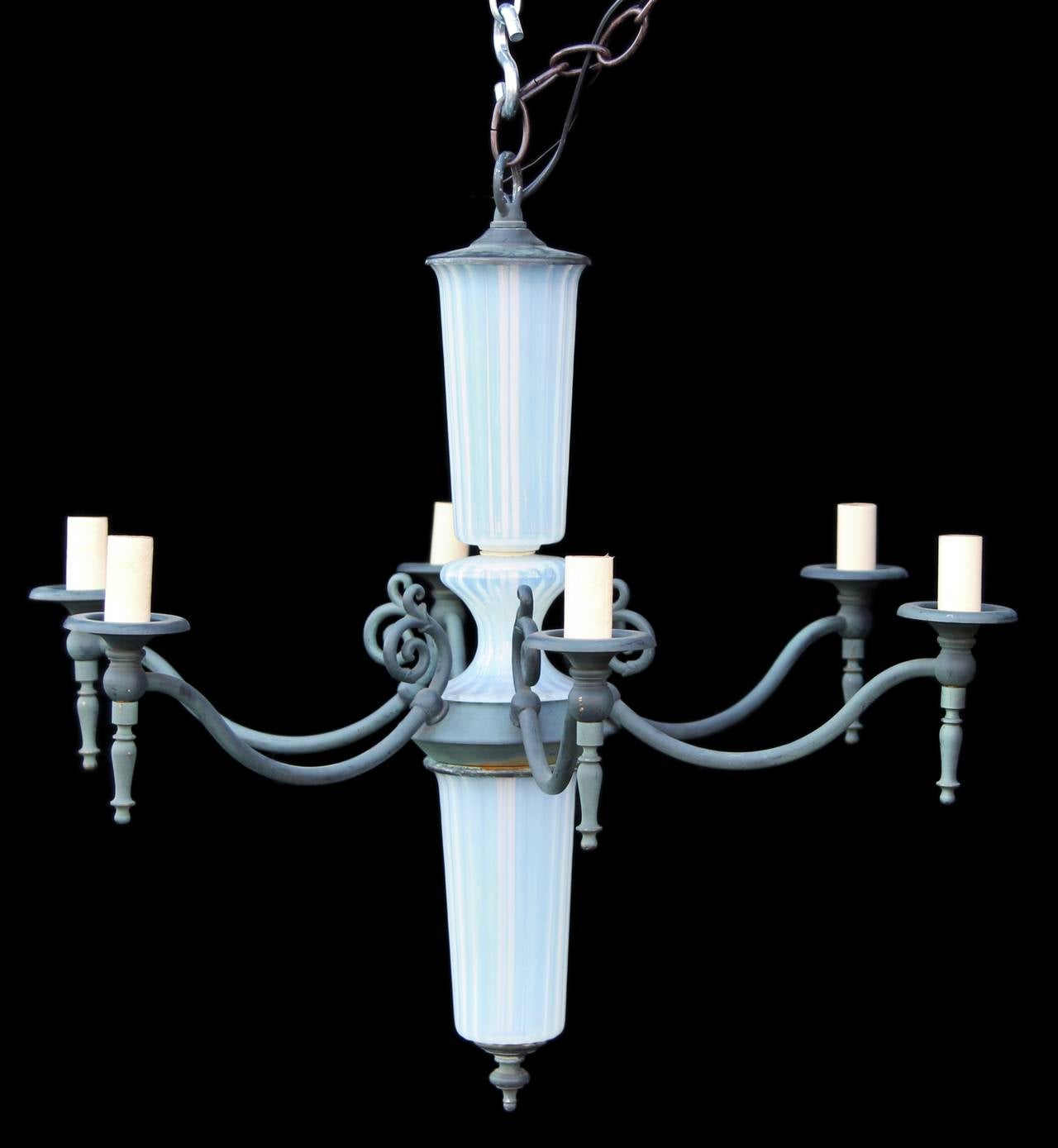1940s French chandelier made of opaline glass with a verdigris finish and has six lights. This item can be viewed at our 302 Bowery location in Manhattan.