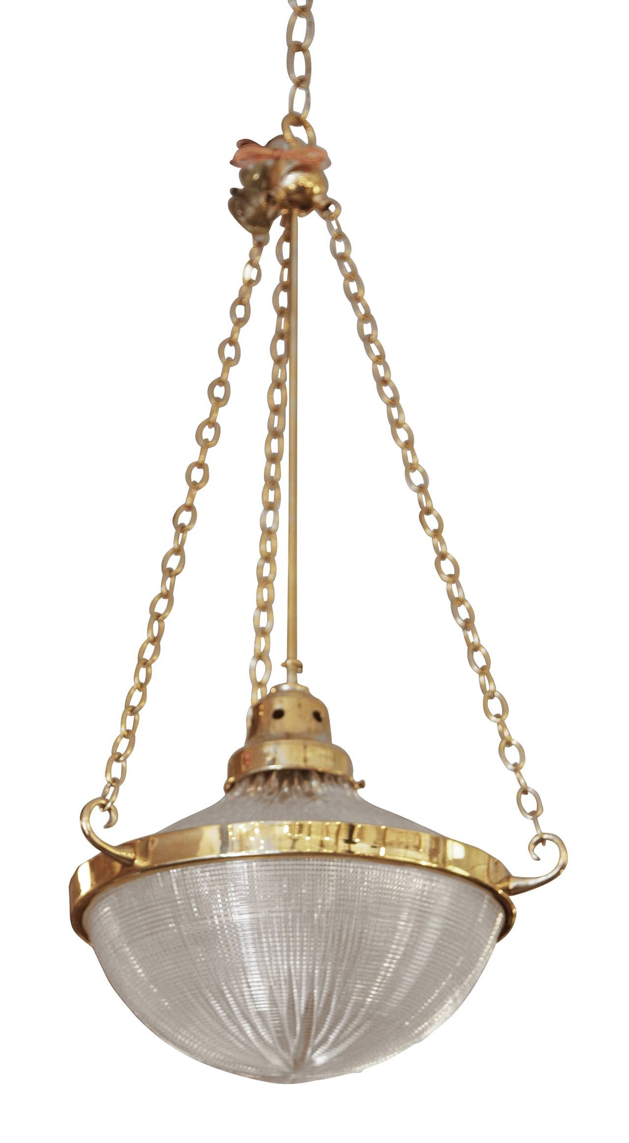 English Holophane pendant light fixture with center bowl attached by center ring and hung with a three chain support. This item can be viewed at our 302 Bowery location in Manhattan.