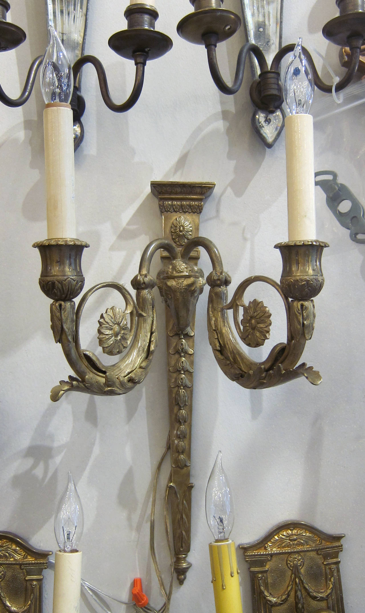 Pair of American made sconces by E. F. Caldwell of New York. Made in 1900s, These sconces is fashioned out of gilt bronze and presented in an Empire style.  This item can be viewed at our 5 East 16th St, Union Square location in Manhattan.