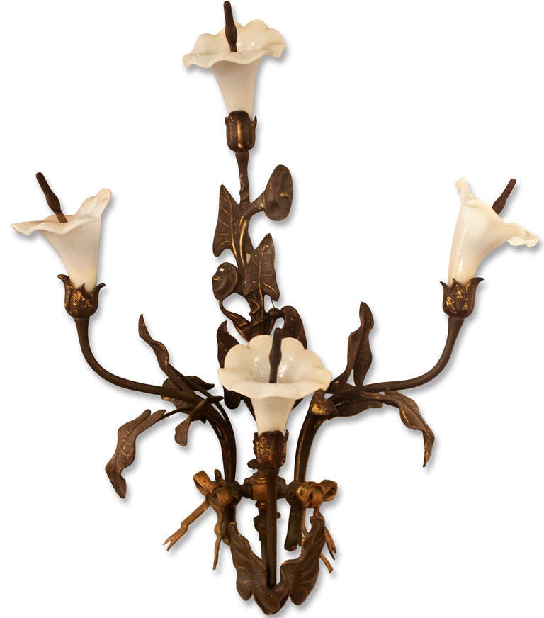 Pair of Art Nouveau bronze gas sconces depicting four stems of lilies each. They have not been electrified. This can be seen at our 400 Gilligan St location in Scranton, PA.