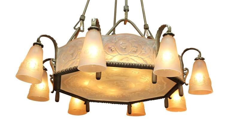 Beautiful example of an Art Nouveau 1910 Muller Freres signed chandelier. Muller Frères were French glass makers located in Lunéville, France at the turn of the century. Each of the outside shades are signed. The shades are molded satin glass. The
