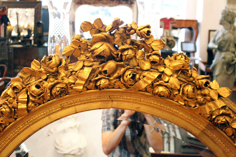 round gold ornate mirror