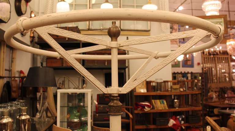 Antique spinning clothing rack with brass details.  This item can be viewed at our 149 Madison Avenue location in Manhattan.