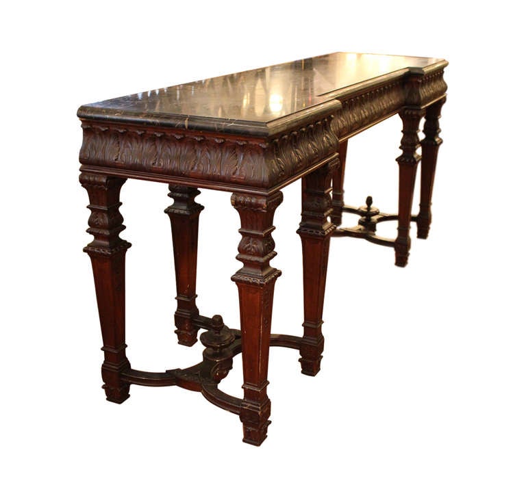 Very attractive 19th century walnut console with three drawers and black marble top. This item can be seen at our store at 149 Madison Avenue in Manhattan.