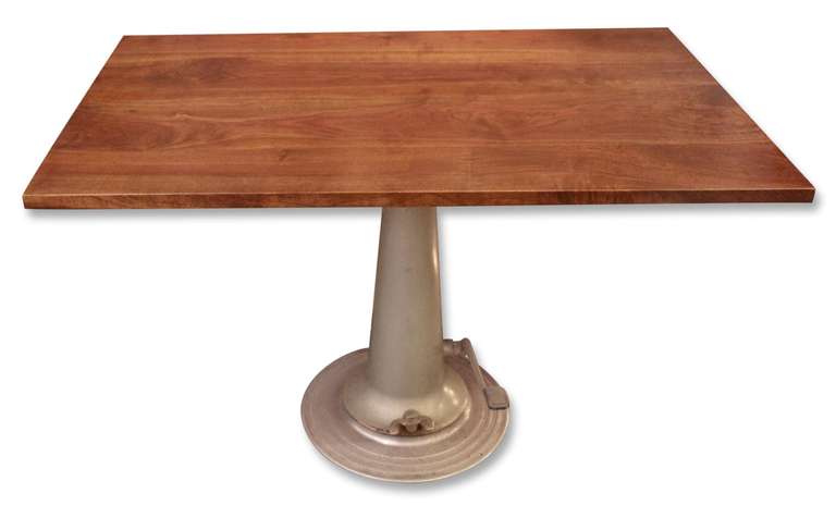 Walnut wooden table top with Nike hydraulic metal base. The table top can rotate atop the base.  The top also goes up and down and angles as well.  This item can be seen at our 302 Bowery location in Manhattan.