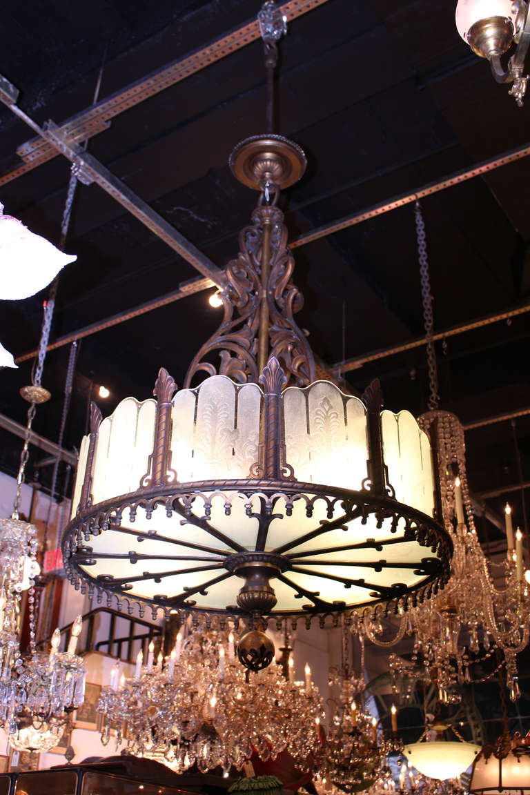 Large Art Deco bronze chandelier with etched glass from a 1929 school auditorium in Part Arthur, Texas. Cleaned and rewired. Priced each. Small quantity available at time of posting. Please inquire. Priced each. Please note, this item is located in