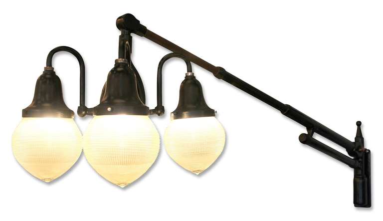 This is  an example of a beautiful 1920 Ritter Dental lamp. This piece is adjustable and can pivot and moves up and down on a spring-loaded arm to angle the light exactly where you want it. This light has a unique 4-way switch that allows the bulbs
