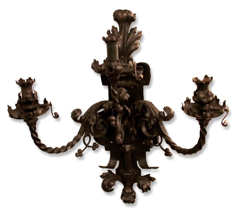 Excellent pair of finely wrought iron gas sconces. Each with three arms and delicate leaf work. This can be seen at our 400 Gilligan St location in Scranton, PA.