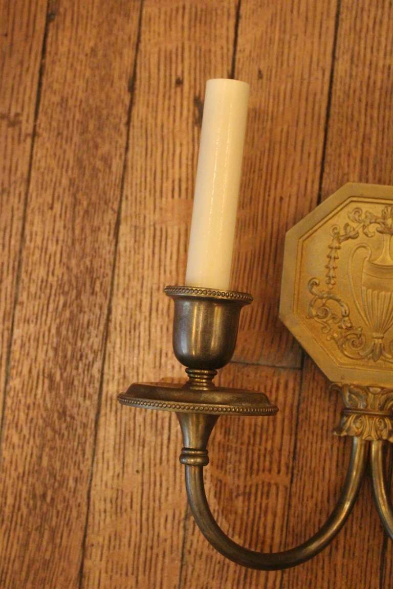 Pair of Caldwell Brass Sconces with Urn Motif In Excellent Condition In New York, NY