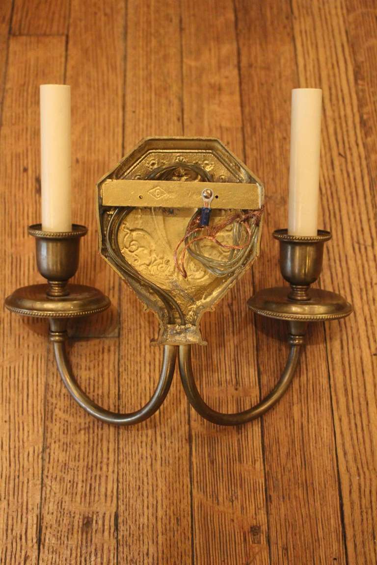 Pair of Caldwell Brass Sconces with Urn Motif 1