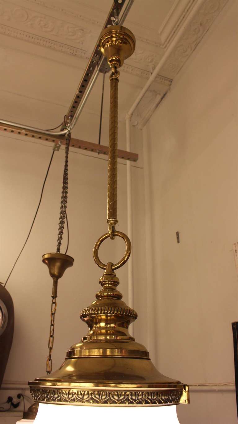 American Pair of Large Milk Glass and Brass Pendant Lights