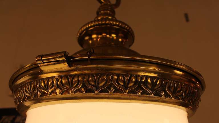Mid-20th Century Pair of Large Milk Glass and Brass Pendant Lights