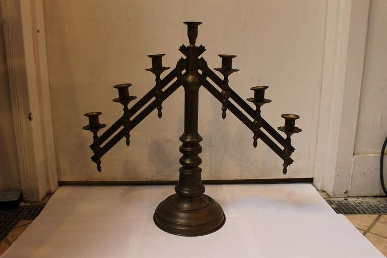 19th century bronze Ecclesiastical candelabra. These items have a seven candle-holding capacity with two adjustable arms and beautiful embellishments. 