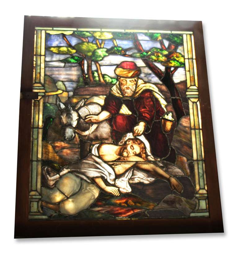 Newly reframed stained glass window of 'The Good Samaritan'.  This item can be seen at our National Warehouse at 400 Gilligan St, Scranton, PA.