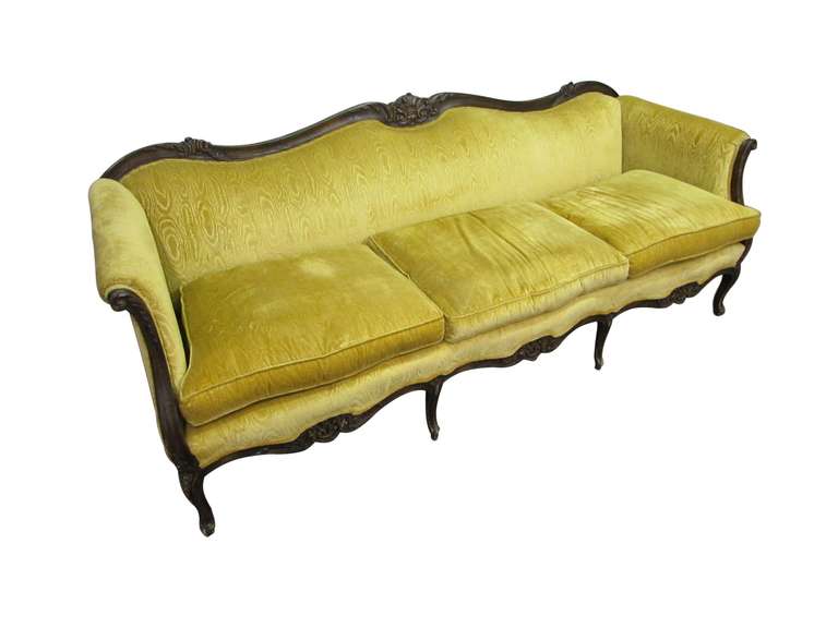 Victorian style carved frame sofa with exquisite canary yellow upholstery. Manufactured for Euster Furniture Co. This can be seen at our warehouse at 400 Gilligan St. in Scranton, PA 18508.