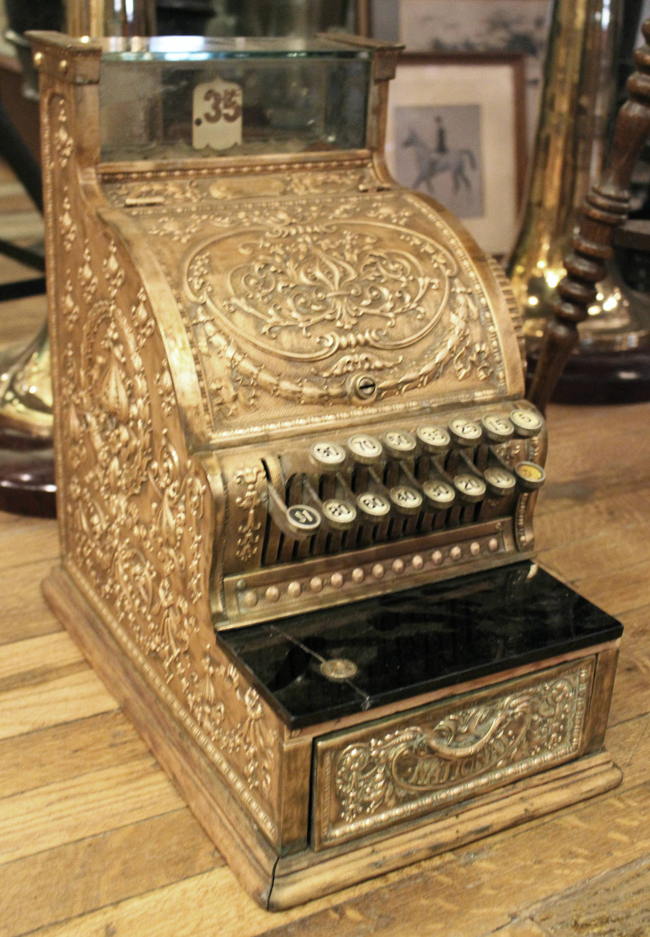 1914 antique bronze National cash register with side printer and dolphin design. There is one crack in black glass. Serial no. 875423 and the model no. 317. This item can be viewed at our 149 Madison Avenue location in Manhattan.