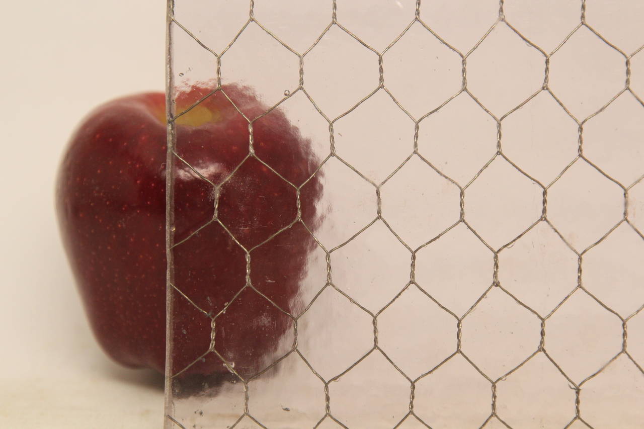 Very faint purple tint due to it's extreme age in the sun. All of our chicken wire glass is salvaged from old factory windows and doors. Sizes may be limited. Please call or email for availability and sizes. Chicken wire glass comes in a variety of