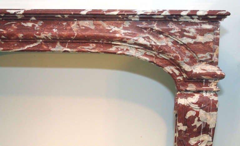 Rosa colored Louis XIV marble mantel. Purchased originally in a group of three from a Paris townhouse. One other mantel in the same size is still available in Breche d'Alep material. This is one of several additions from Danny Alessandro & Edwin