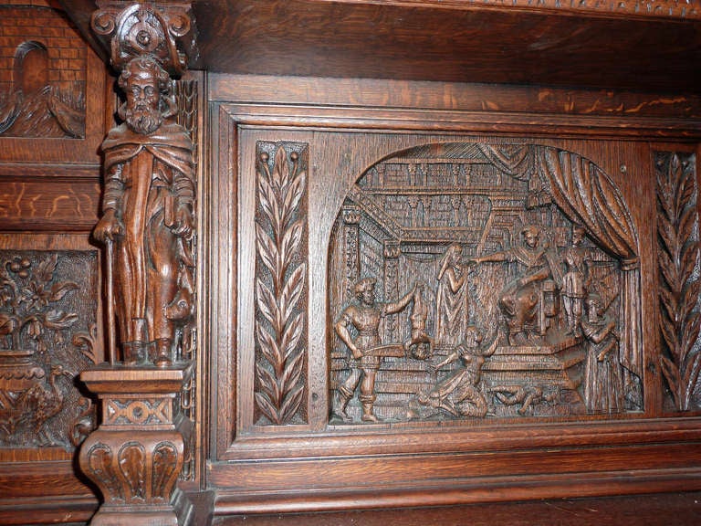 Heavily Carved Wooden English Tudor Mantel with Figures at 1stDibs