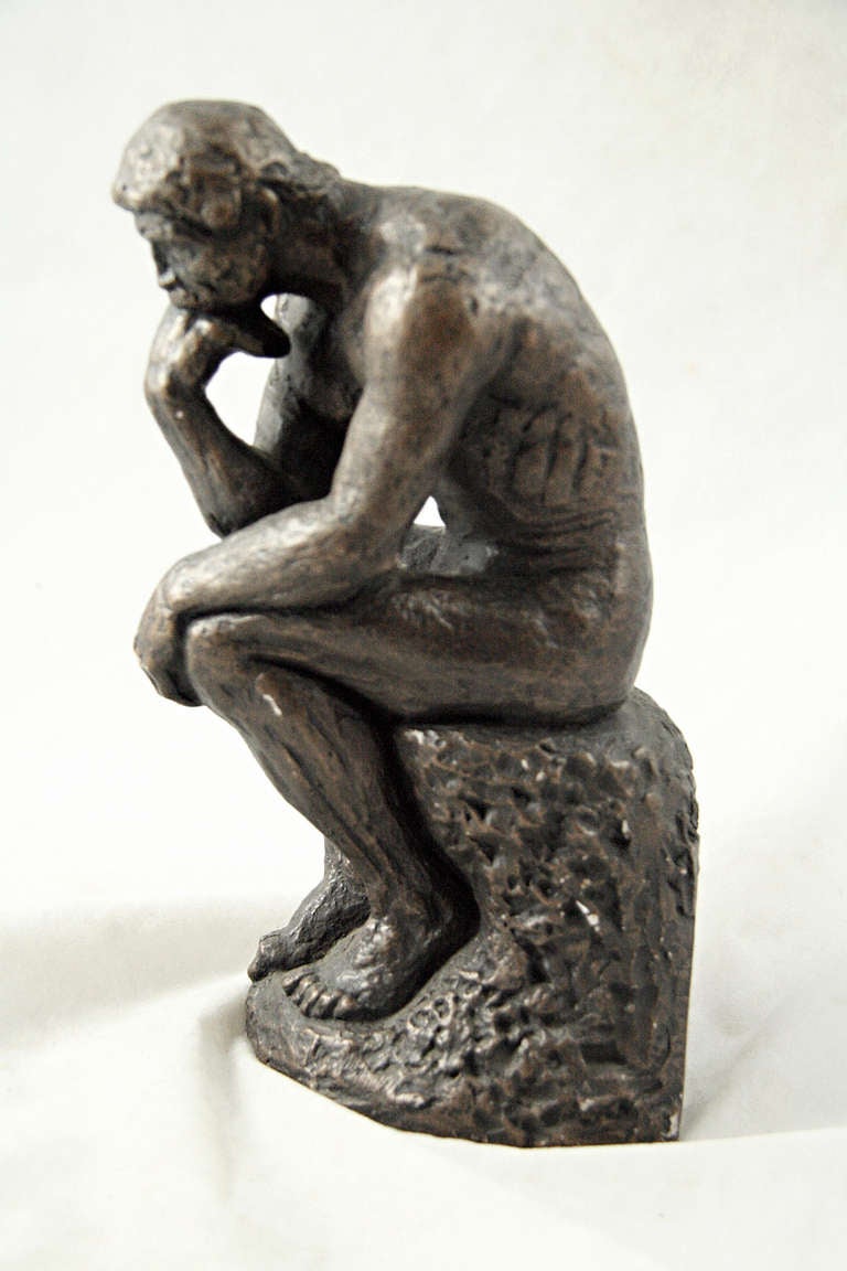 Plaster statue of 'The Thinker' with bronze enamel, a replica. This item can be seen at our National Warehouse at 400 Gilligan Street in Scranton, PA.