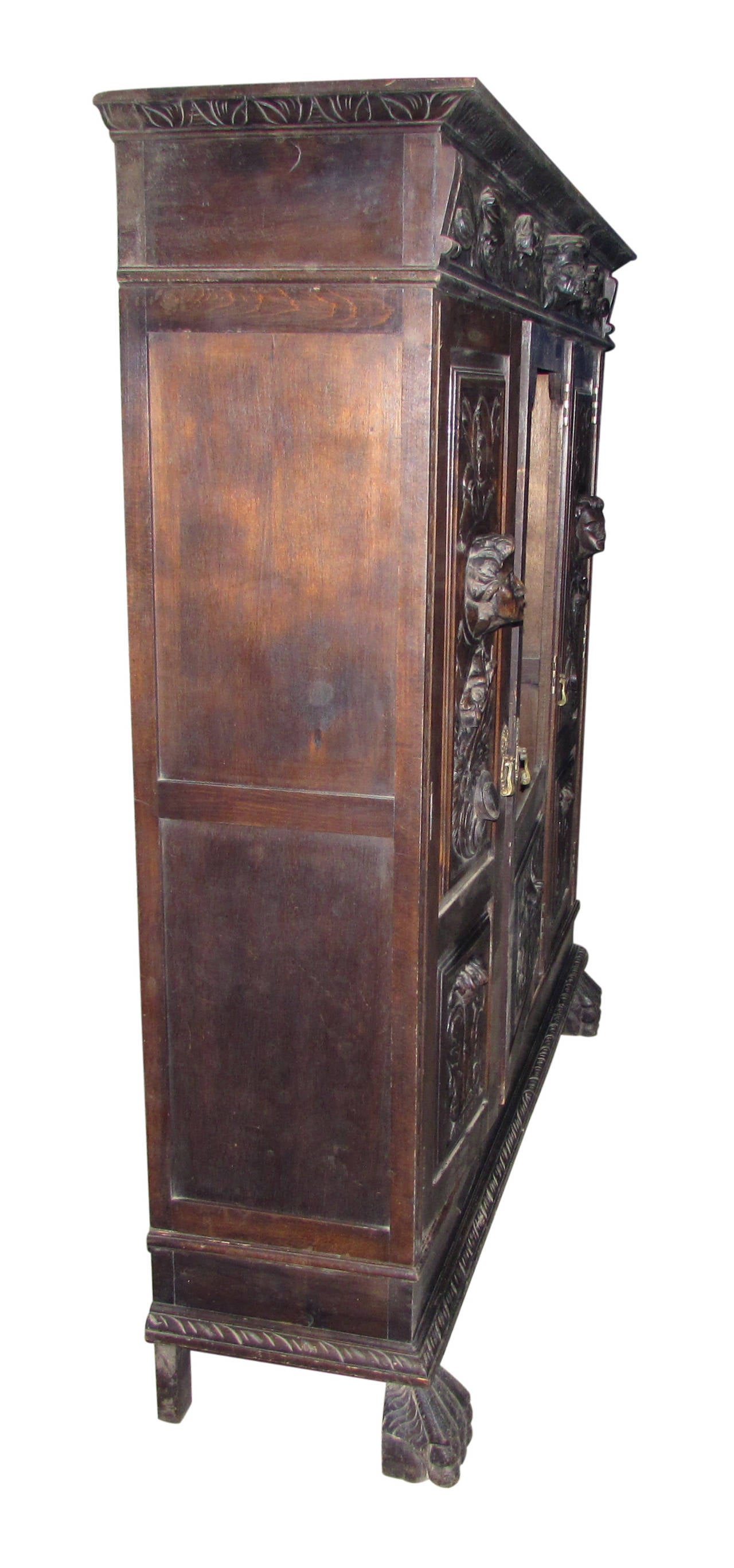 Wood 1880s Hand-Carved Figural Cabinet with Claw Feet, Faces and Interior Light