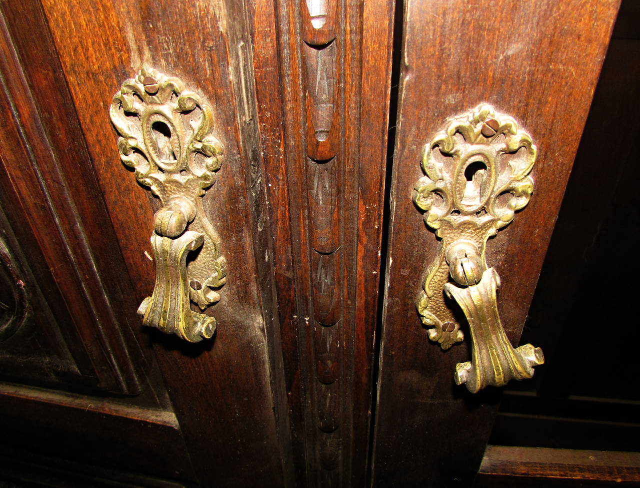 1880s Hand-Carved Figural Cabinet with Claw Feet, Faces and Interior Light In Good Condition In New York, NY
