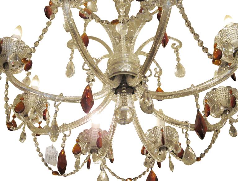 French Regency eight-light crystal chandelier from 1920. Colored crystals. Crystal swags. This can be seen at our 124 West 24th St. store in Manhattan.