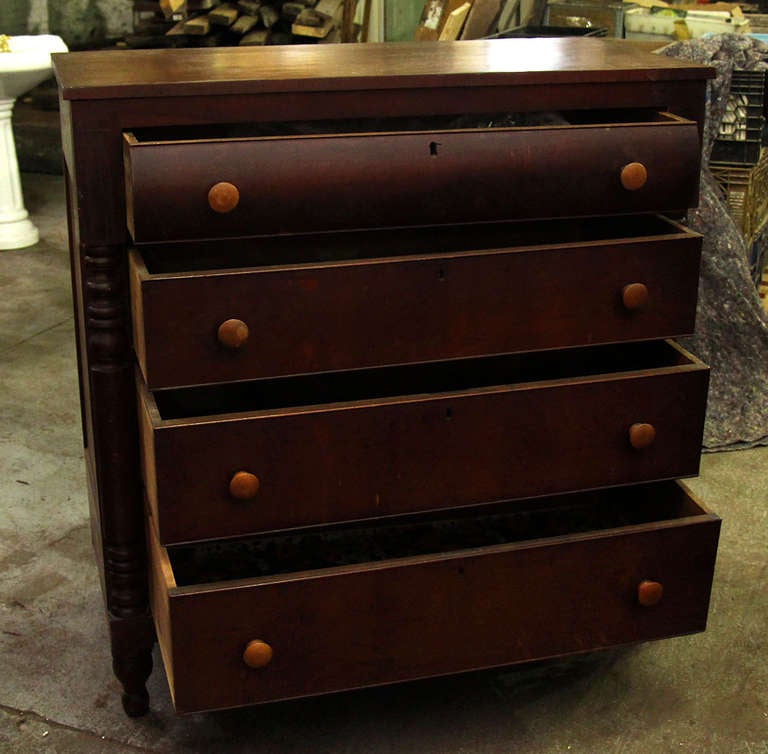 This piece has four drawers and wooden knobs. Beautifully carved side columns.