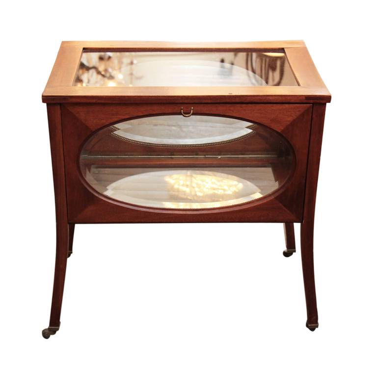 Mahogany and Oval Beveled Glass Vitrine