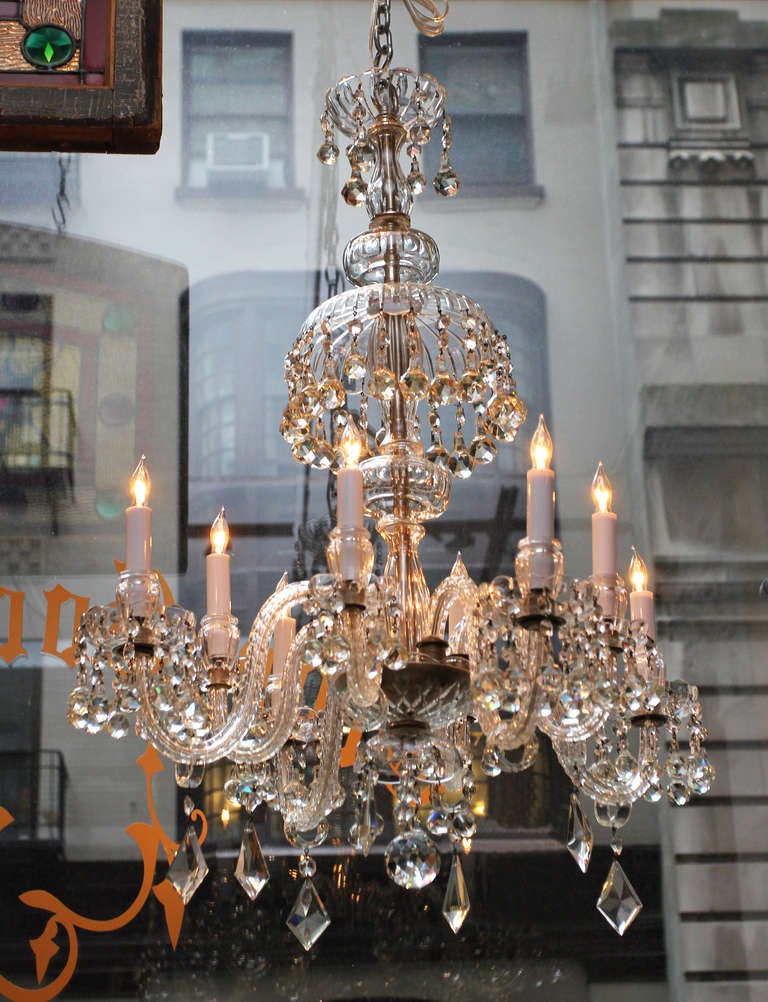 Beautiful leaded crystal pendants hanging from the eight armed light and center canopy.  Waterford crystal originated in Waterford, Ireland. This can be seen at our 5 East 16th St. store at Union Square in Manhattan.
