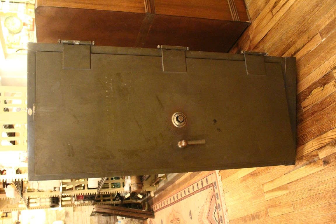 Art Metal standing safe with working combination lock and handle. Removable file inserts included.