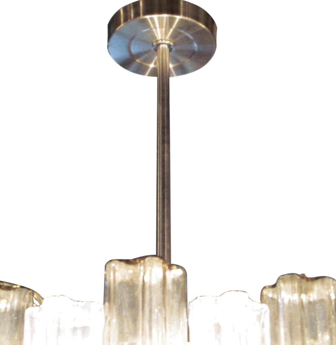 1960s Mid-Century Modern Murano tronchi three tiered pendant light by Venini with smoked and clear crystals.
This can be seen at our 2420 Broadway location on the upper west side in Manhattan.