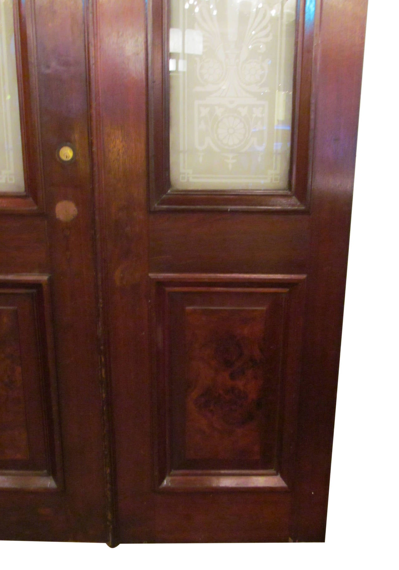 1930s double doors with ornate etched glass urn design panels. Each panel displays the number 52 in gold leaf which can be removed. This can be seen at our 2420 Broadway location on the upper west side in Manhattan.