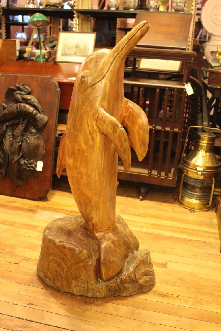 wooden dolphin statue