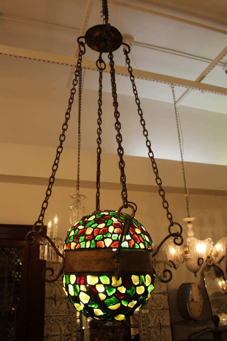 Colorful mosaic hanging light in vibrant green, white and red glass pieces. This can be viewed at one of our New York City locations. Please inquire for the exact address.