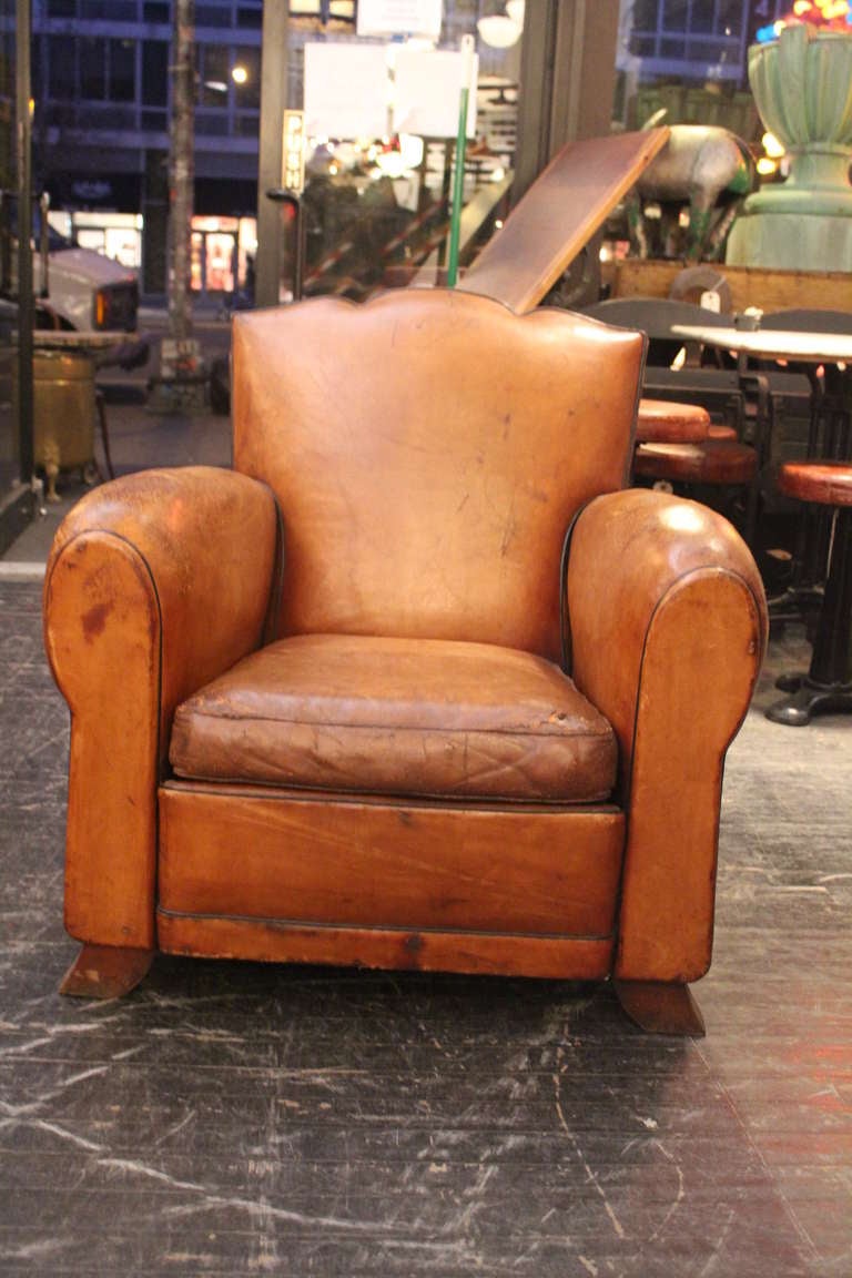 Single French mustache back style deco club chair. Classic gentlemen cigar lounge chair with desirable patina throughout.