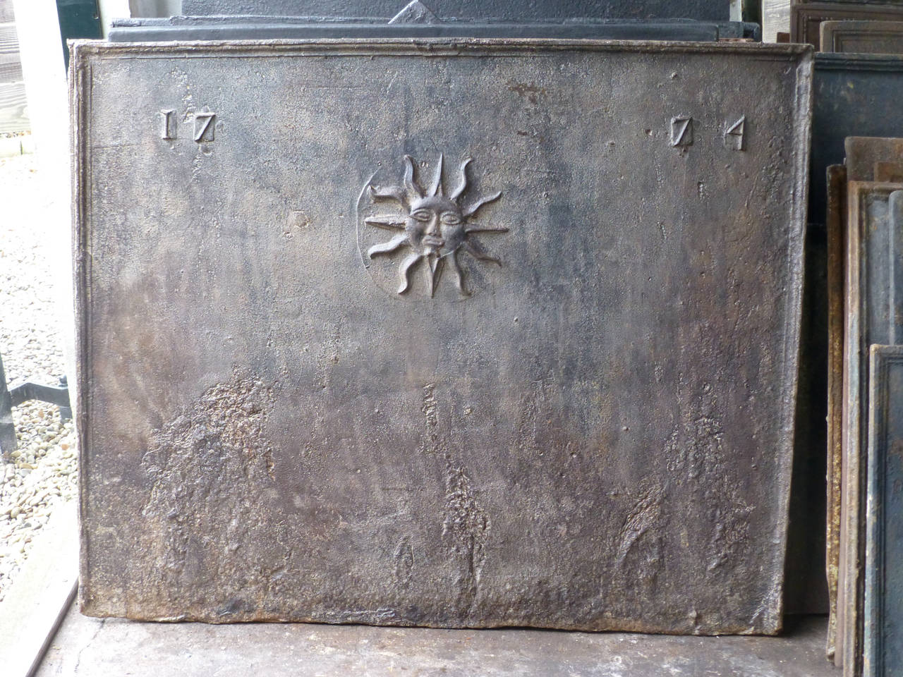 The sun fireback representing Louis XIV.

We always have 500+ antique and vintage firebacks in stock in all dimensions, styles and designs. Contact us our current stock and prices.