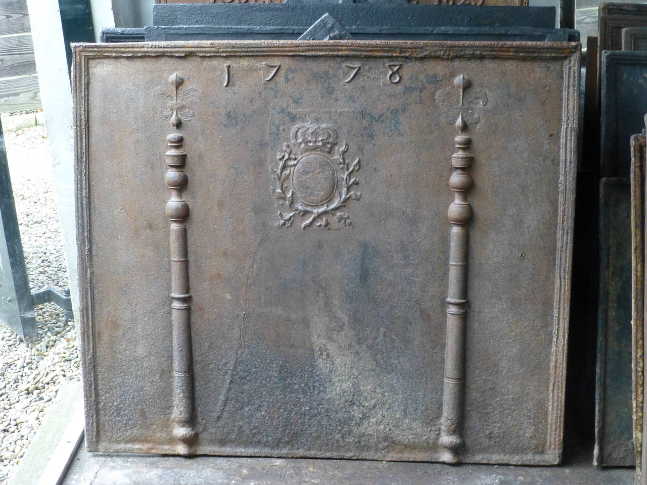 With Arms of France and the date 1778. The fleurs de Lys are partially truncated after the French Revolution.

We have a unique and specialized collection of antique and used fireplace accessories consisting of more than 1000 listings at 1stdibs.