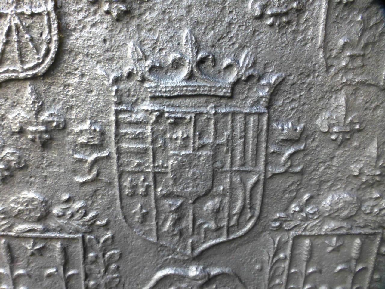 17th century French fireplace fireback with the arms of Lorraine (center), flanked by the arms of Bar-le-Duc and the arms of France and Navarre (left and right upper sides). The arms at the bottom side are of unknown origin.

We have a unique and