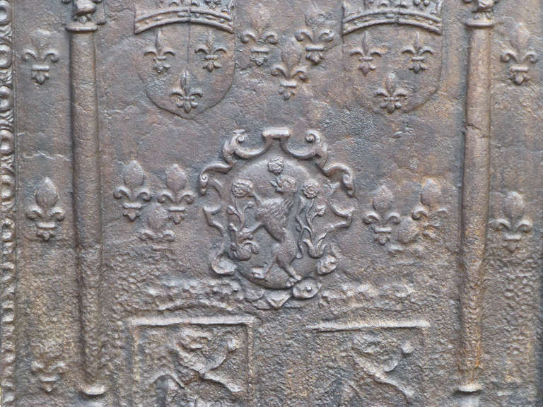 16/17th century Arms Of France Fireback with Fleurs de Lys and an unknown coat of arms.

We have a unique and specialized collection of antique and used fireplace accessories consisting of more than 1000 listings at 1stdibs. Amongst others we always