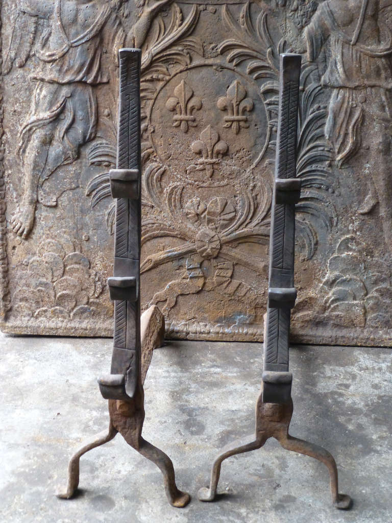 17th c. Louis XIII Andirons, Firedogs. These French andirons are called 'landiers' in France. This dates from the times the andirons were the main cooking equipment in the house. They had spit hooks to grill meat or poultry and sometimes a cup to