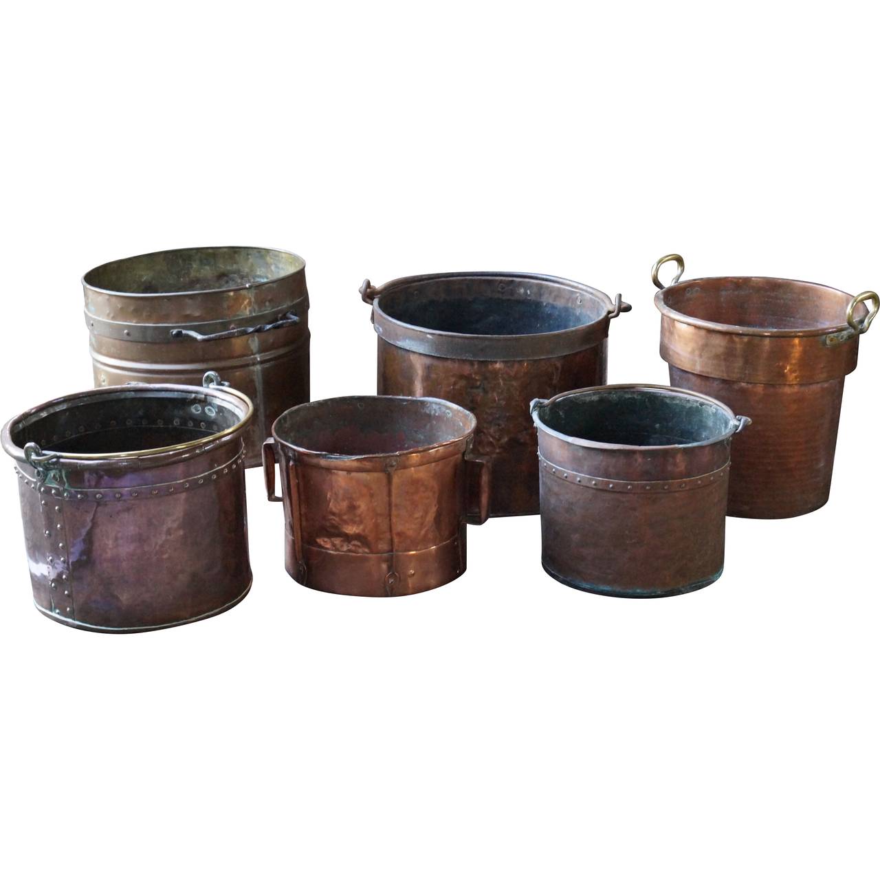 Polished and unpolished copper firewood baskets - log bins, large and small to fit any fireplace. 

We have a unique and specialized collection of antique and used fireplace accessories consisting of more than 1000 listings at 1stdibs. Amongst