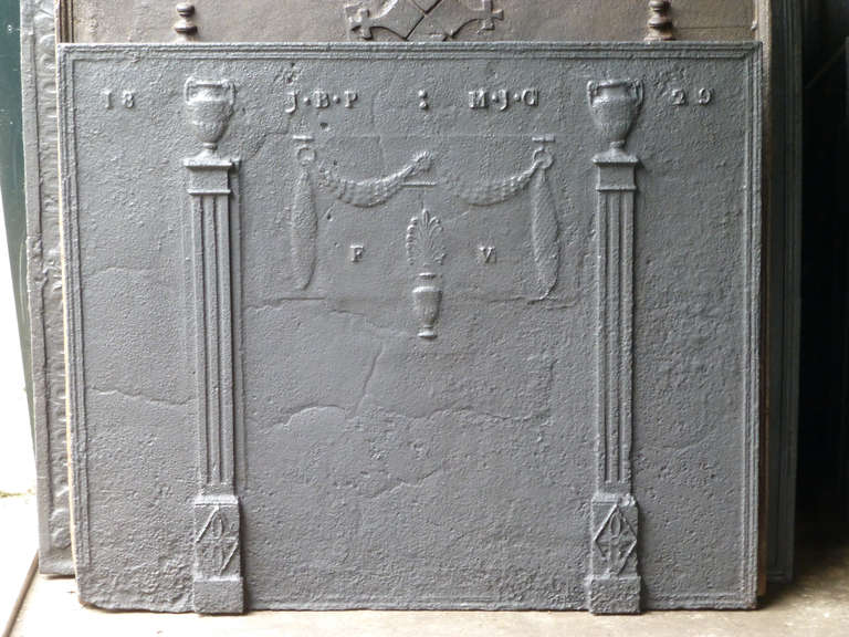 Neo-classical decorative fireback with pillars of freedom, celebrating a marriage in 1829.

We have a unique and specialized collection of antique and used fireplace accessories consisting of more than 1000 listings at 1stdibs. Amongst others we